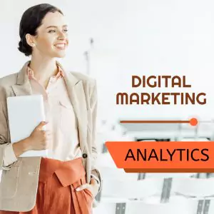 Woman in business attire holding a tablet stands in a bright room. Text reads "Digital Marketing Analytics.